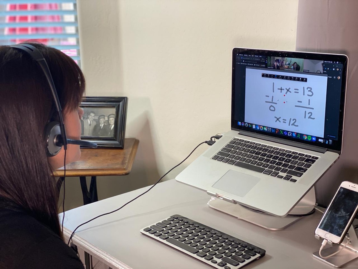Certified tutor working one-on-one with a student in an online session
